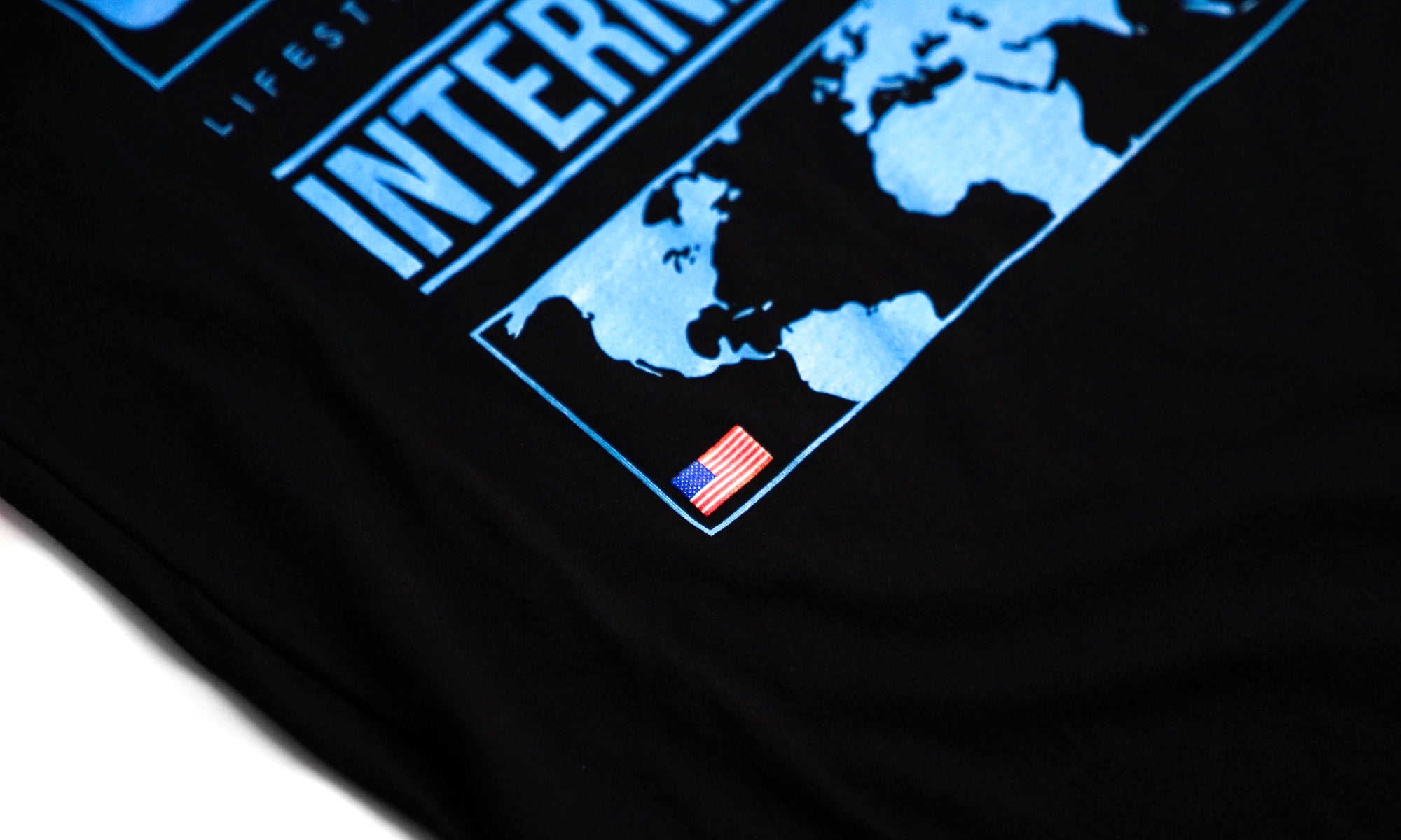 International Tee- Black / Light Blue